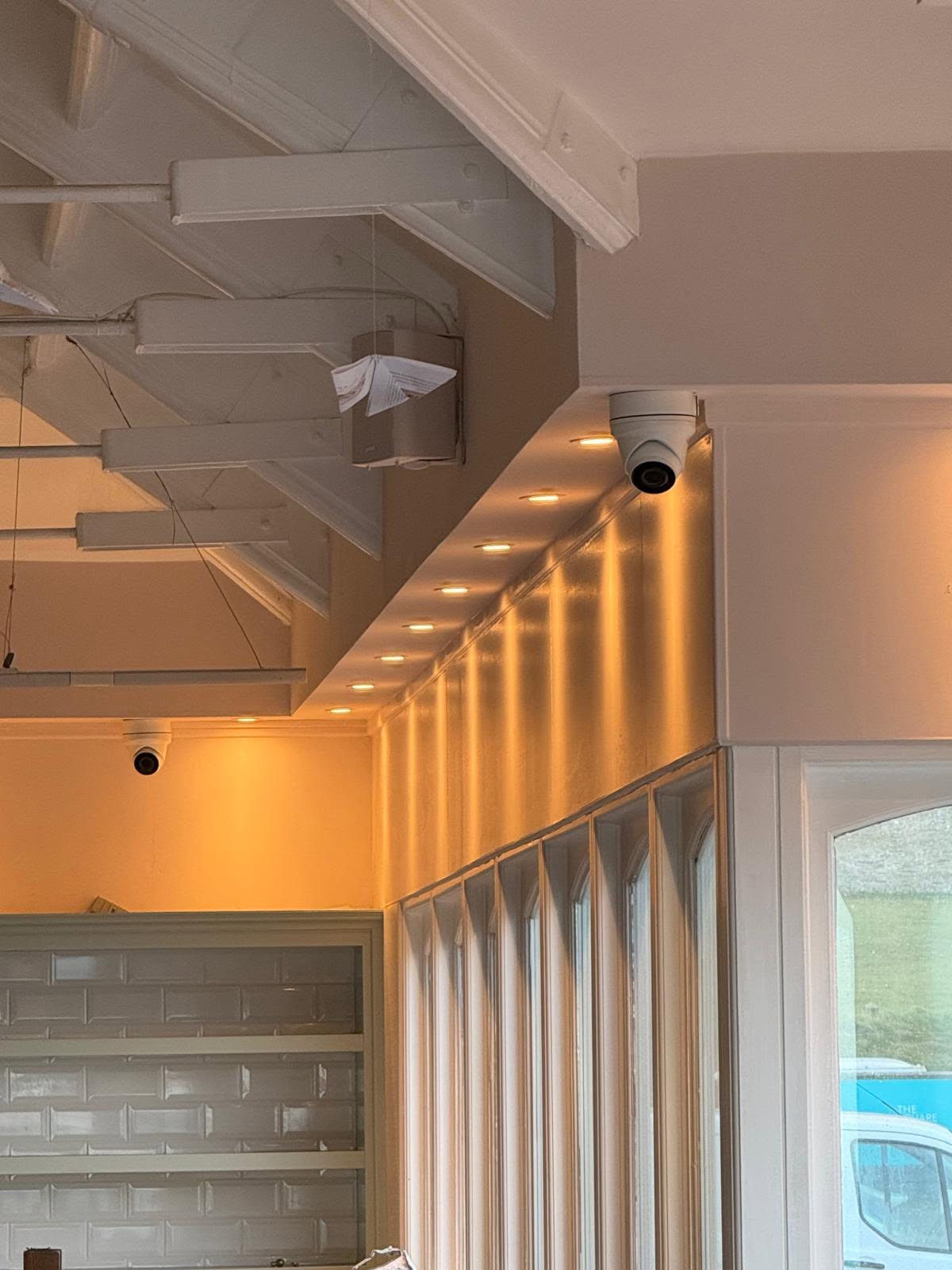 Hero shot: close-up of a high-end IP dome or bullet camera, subtle lighting