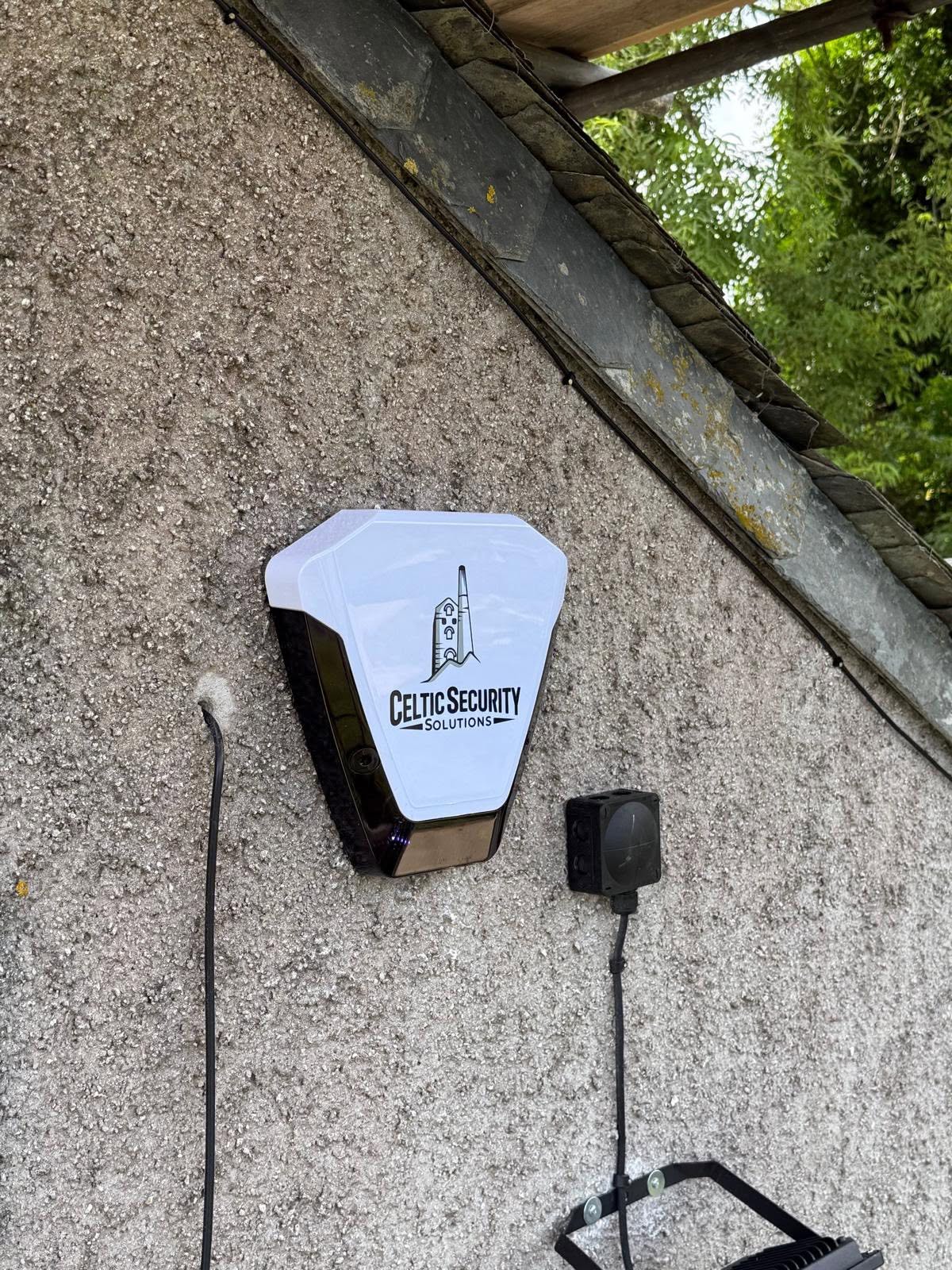 Hero shot: a glowing modern intruder alarm keypad at night